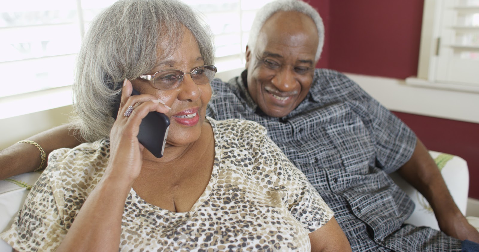 A woman takes a hearing test on her mobile phone