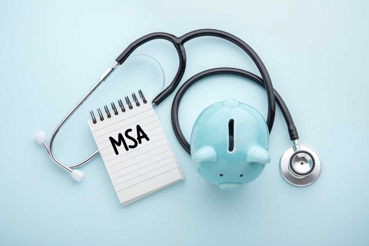 Piggy bank with MSA written on a notepad