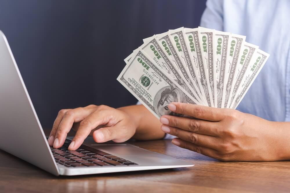 man accessing online title loan cash