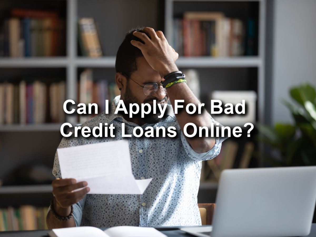 man fustrated with bills and is applying for payday loans online