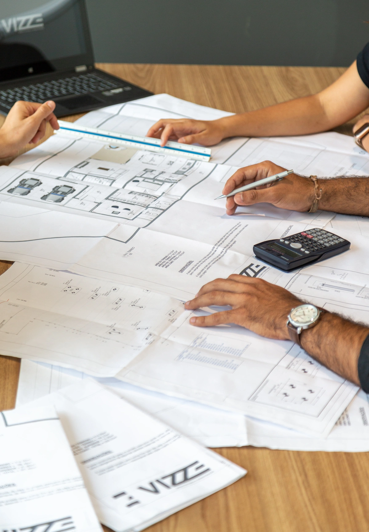 Architectural plans spread on a desk