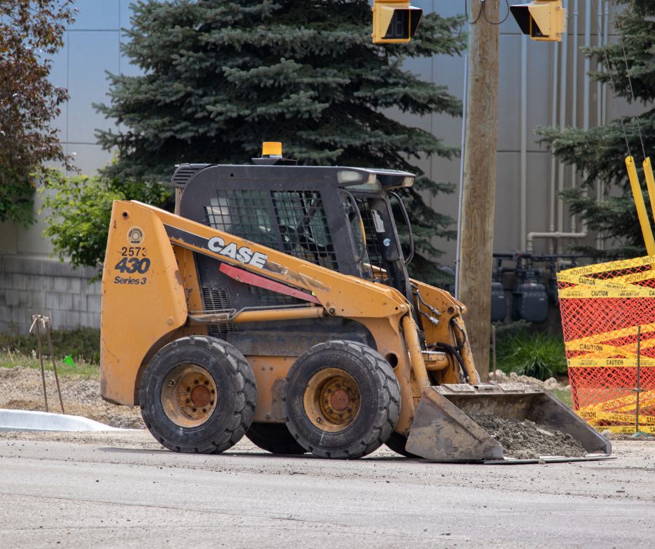 CASE skid steer with a bucket attachment on a job site