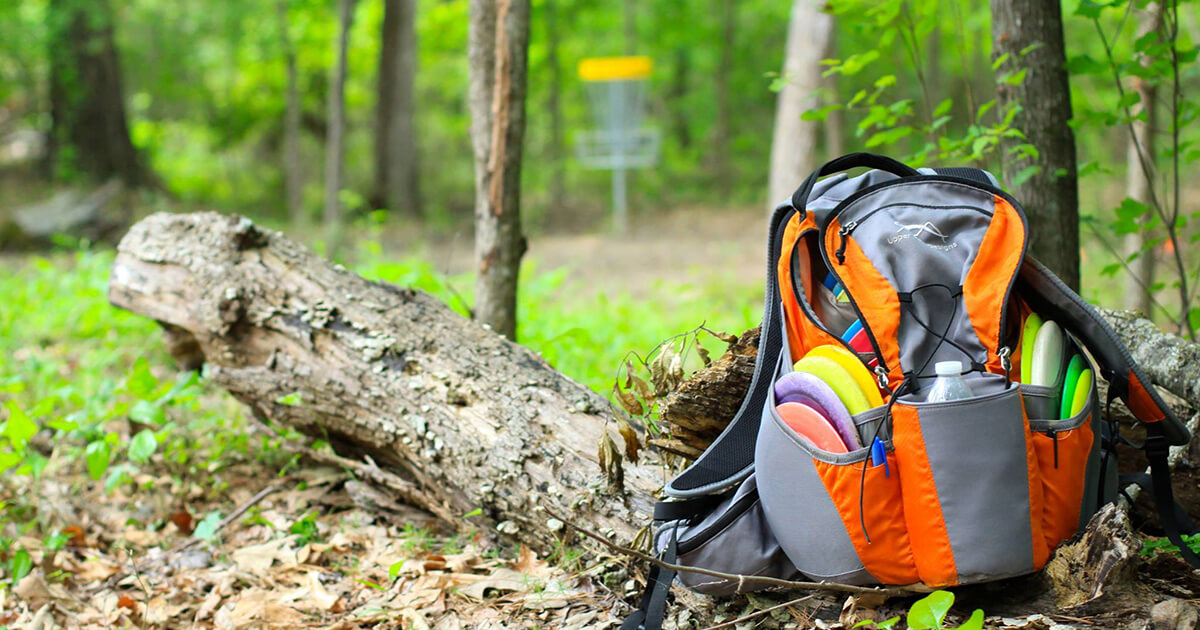 A disc golf backpack bag in the forest