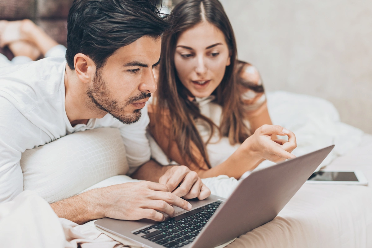 Young couple learning about fertility insurance coverage