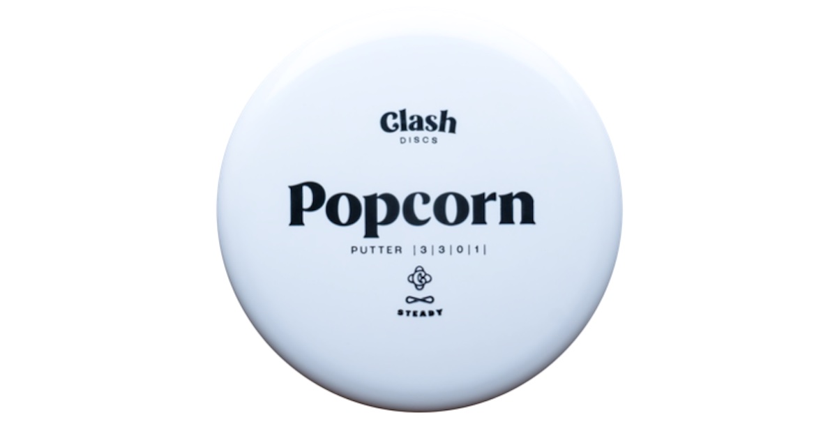 A white disc golf disc with the name "Popcorn" prominent across the center