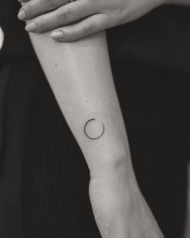 minimalist tattoo of a circle