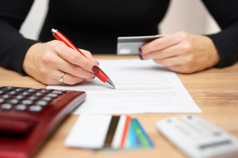 Woman looking at credit card bill
