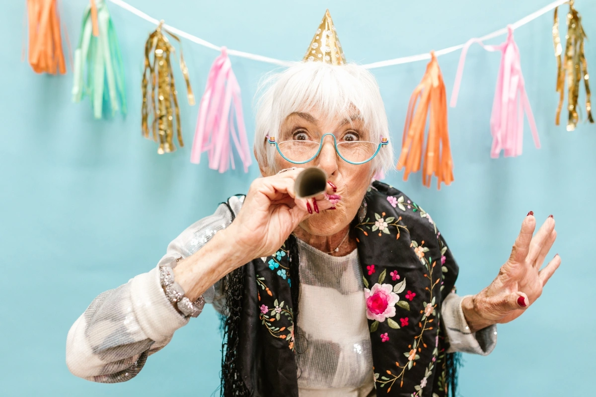 woman celebrating her initial medicare enrollment period