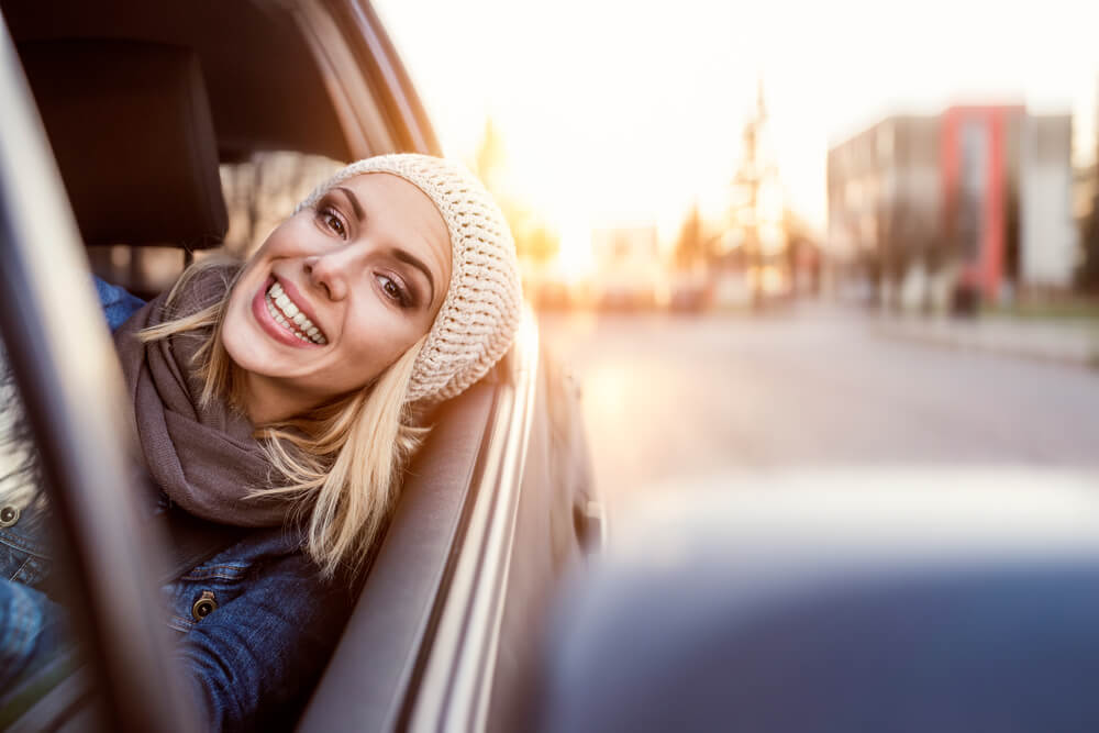 woman smiling in car