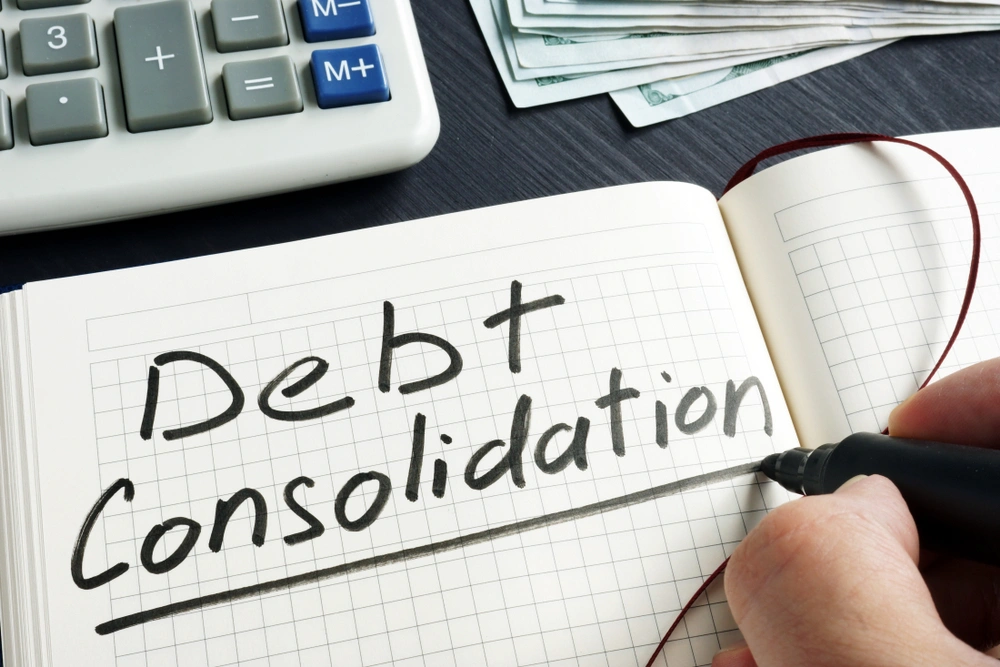 Debt Consolidation written on a notepad