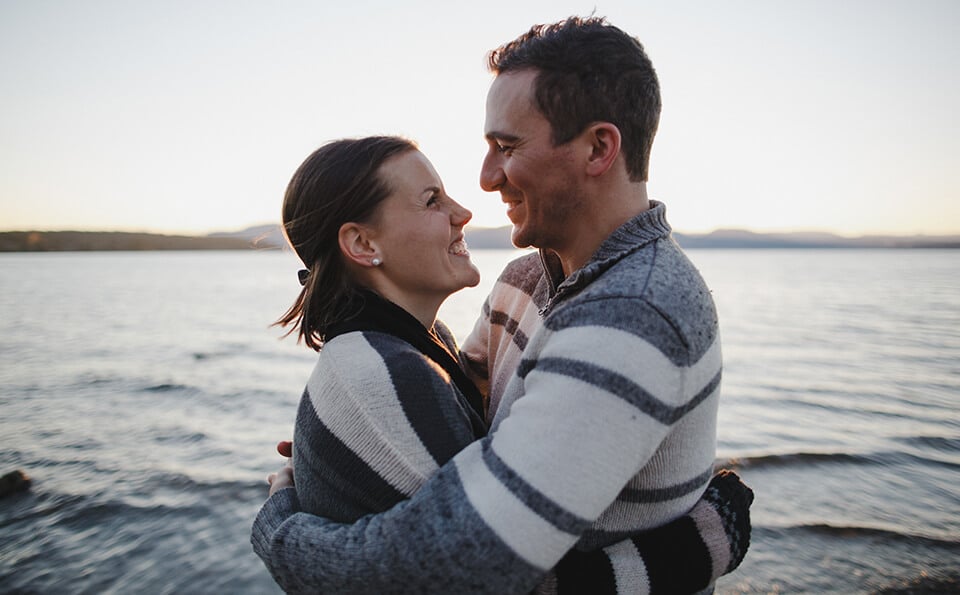 couple embracing near the sea