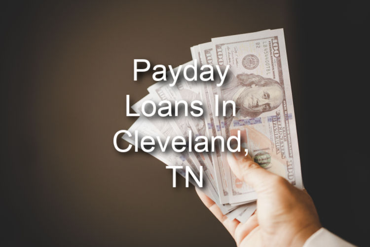 hand holding payday loan cash with text payday loan in cleveland, tn