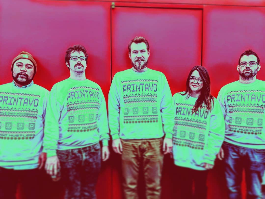 Some of Printavo's team in their holiday sweaters