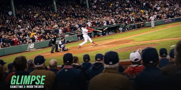 Fans in a baseball stadium watching a batter