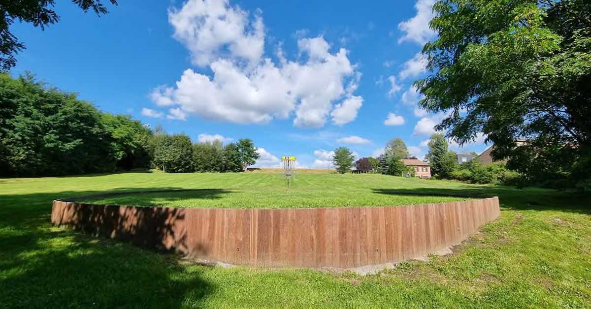 Basket on green grass on a built-up plateau