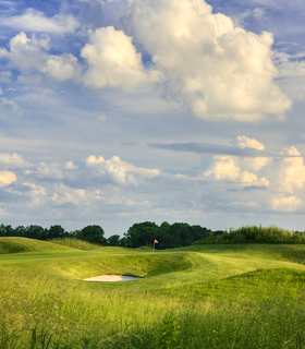 Cloudy skies over a golf course