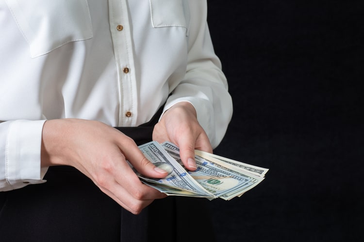 Woman holding title cash in MS
