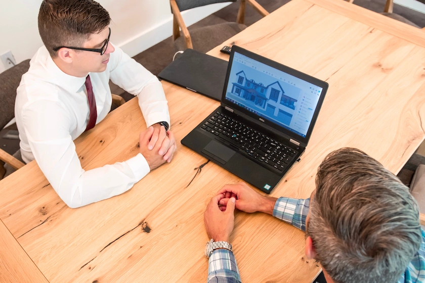 2 architects looking at laptop