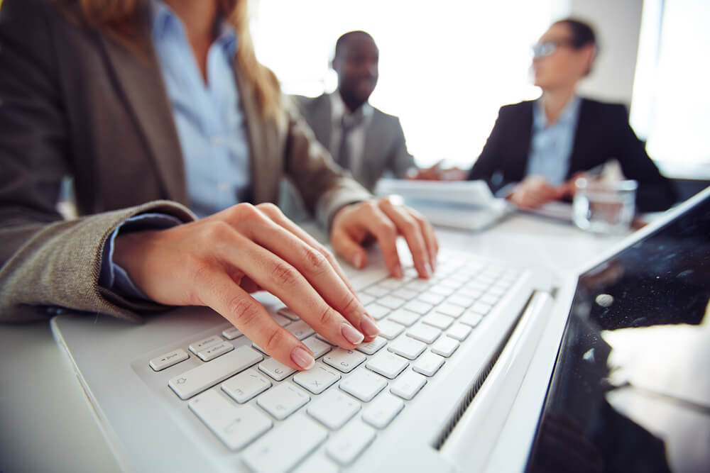 Someone typing on a computer keyboard