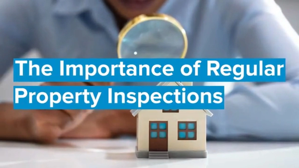 Person looking at a house through a microscope