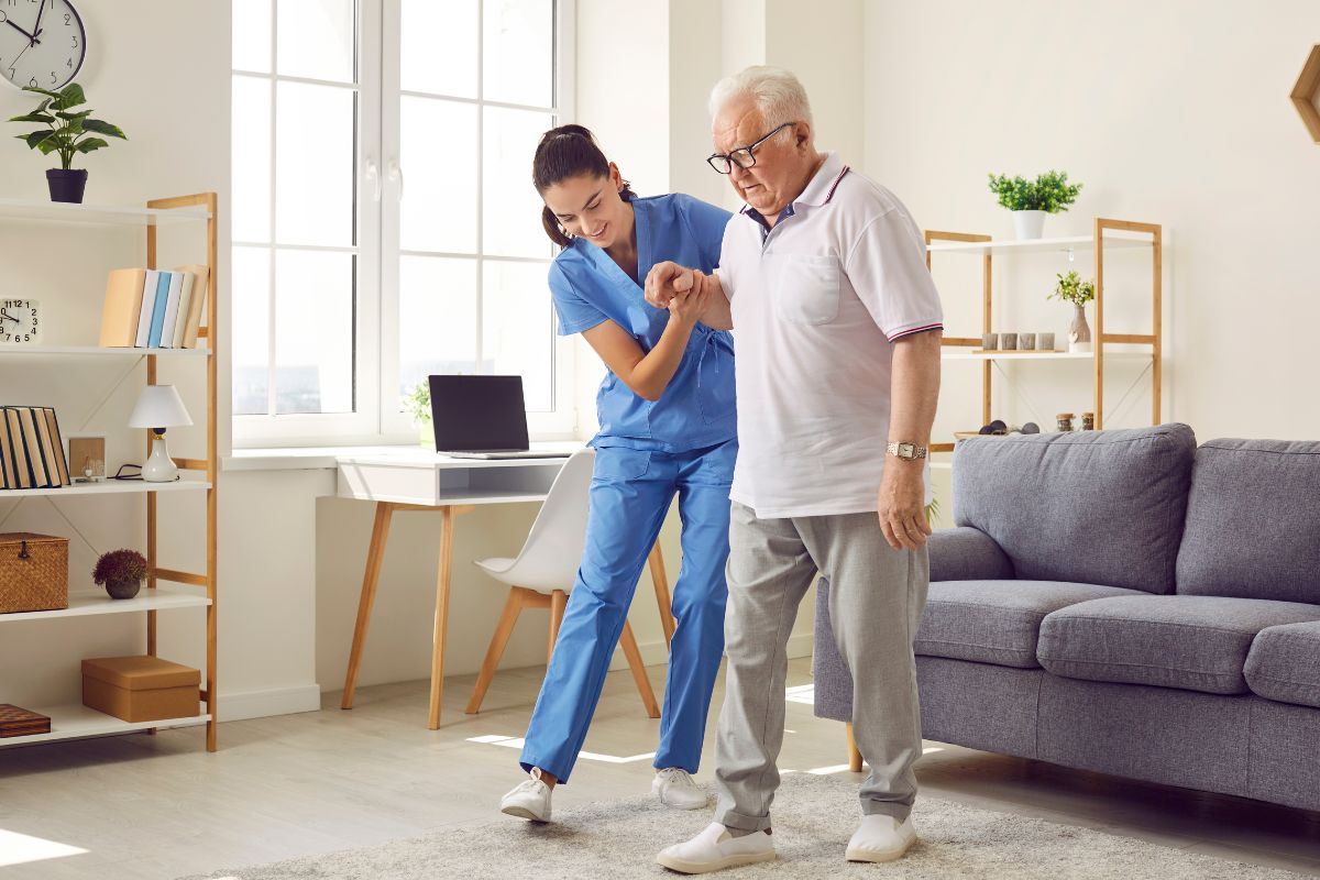 Nurse helping Medicare beneficiary with activities of daily living