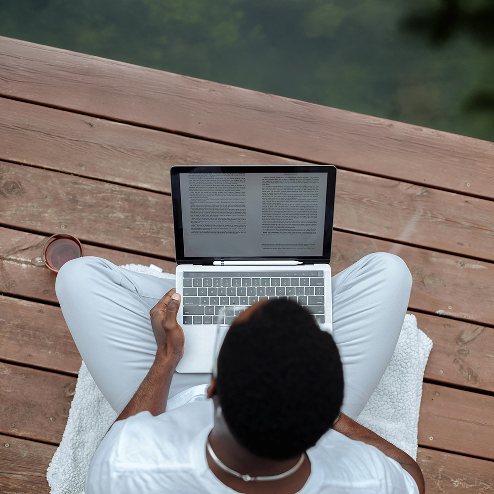 A Man in Working on Laptop.webp