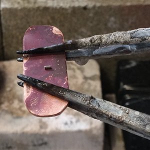 Copper piece with solder on two third hands