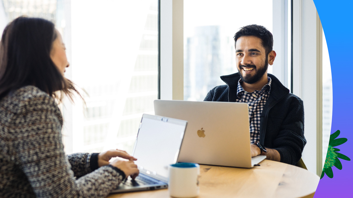 Two people working on their laptops