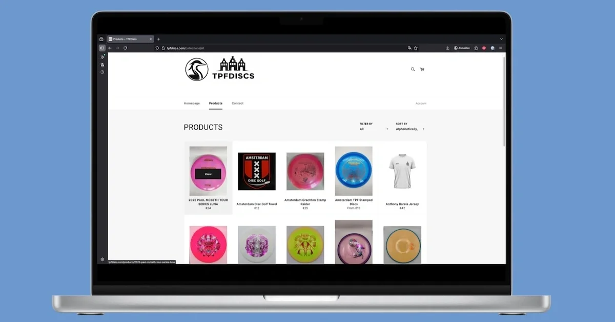 A screenshot from.a disc golf retail site in a Macbook frame on a blue background
