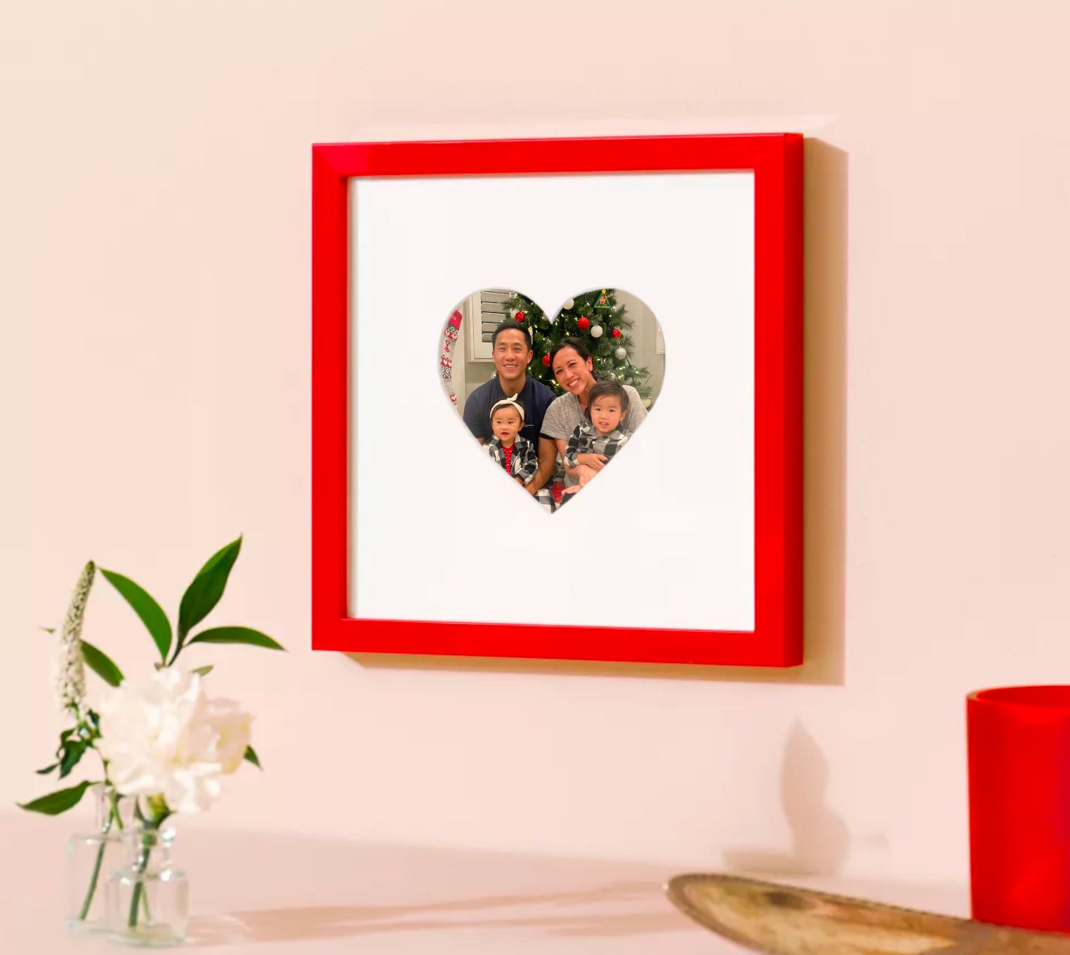 red frame with heartshaped mat and photo of cute family