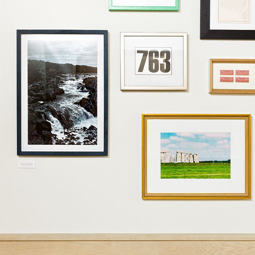 closeup photo of store with gallery wall of frames