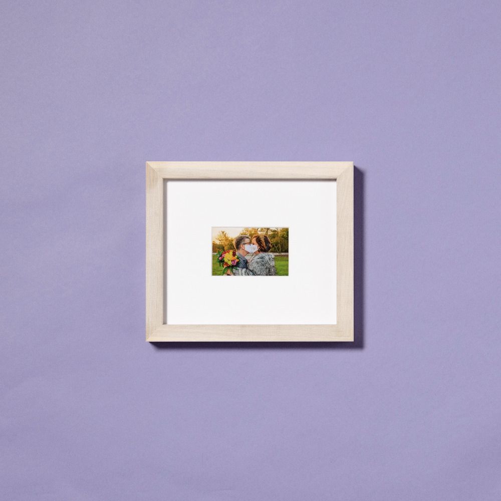 framed photo of couple kissing in masks