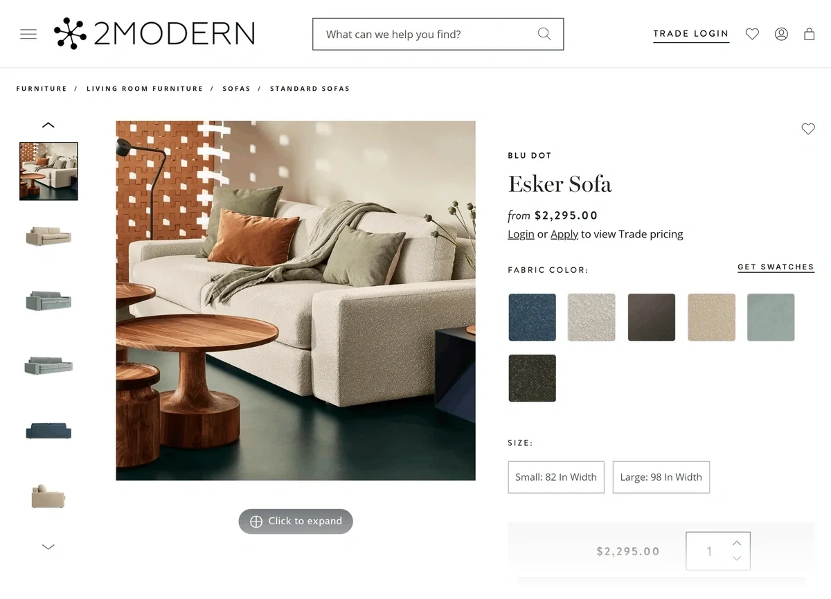 A tan sofa with green and orange pillows is shown for sale on the 2modern website.