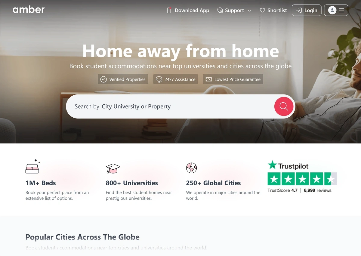 The Amber homepage shows a man relaxing with headphones