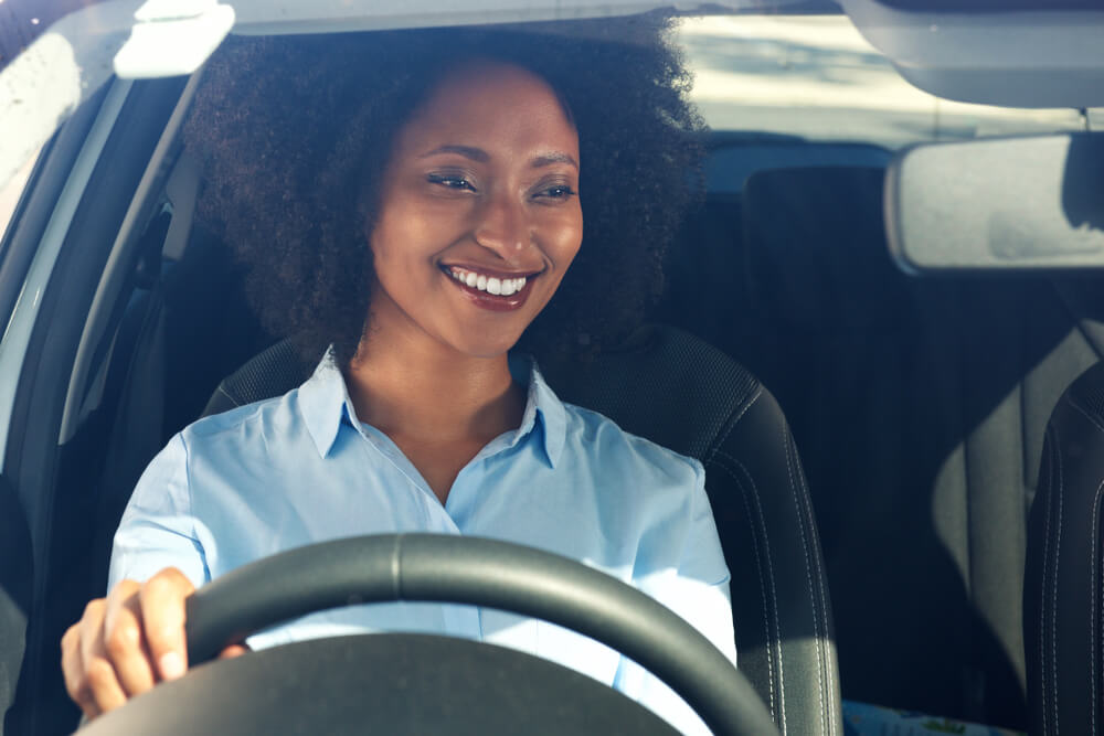woman driving to a meeting with a title loan agent