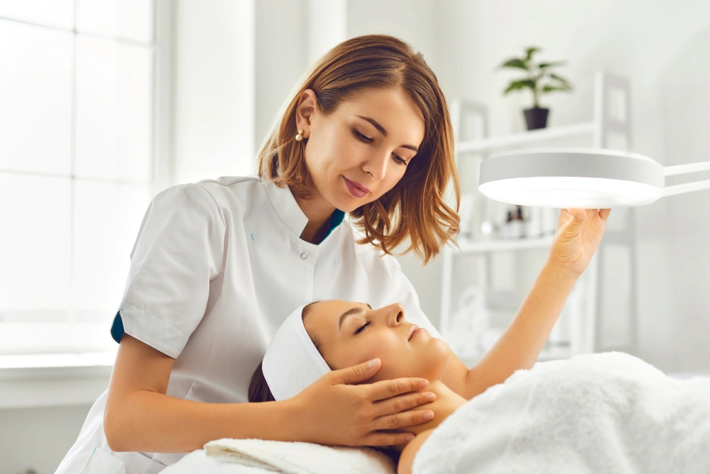 Woman in dermatology clinic getting assessed