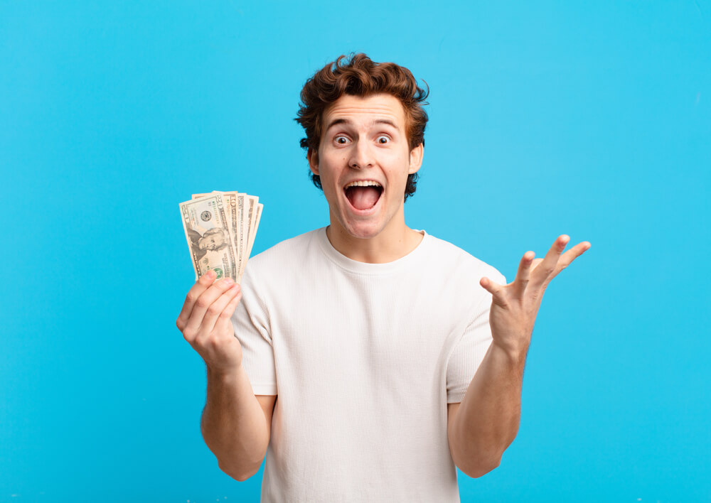 man happy about fast payday loans