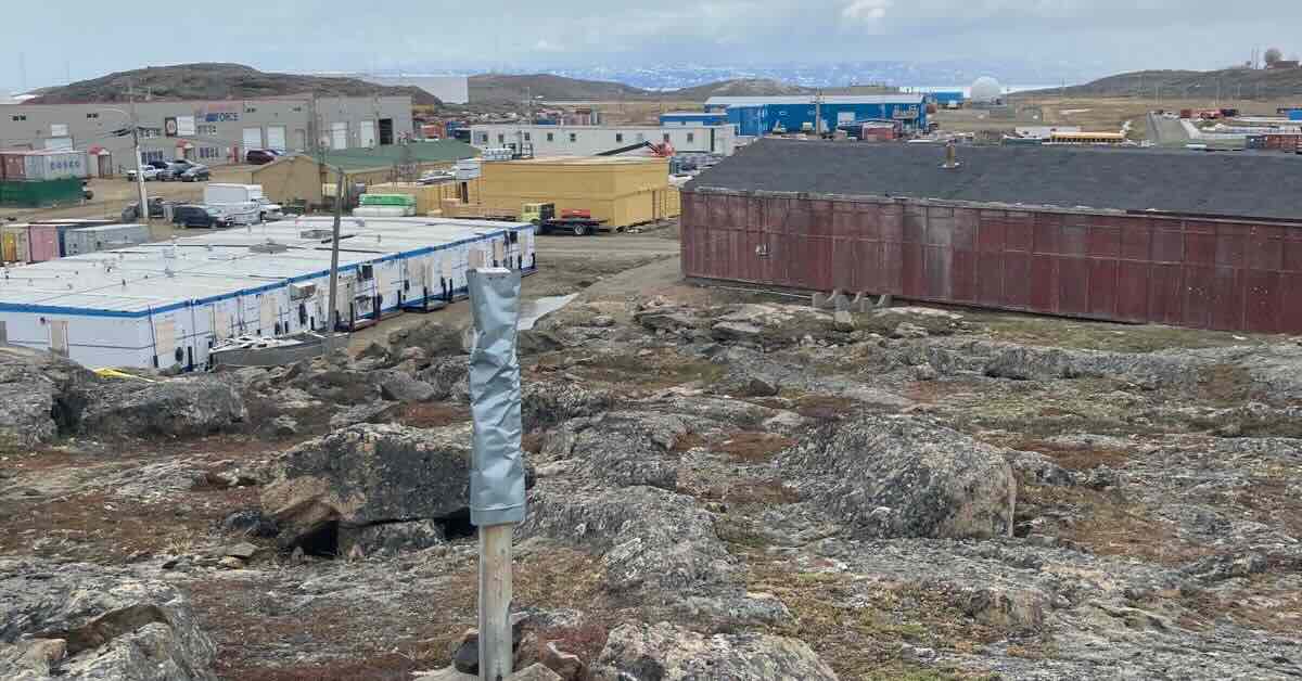 A metal-wrapped stick in a far north settlement