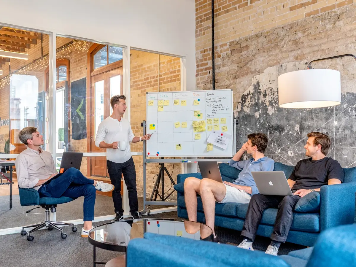 A leader showing his team a presentation.