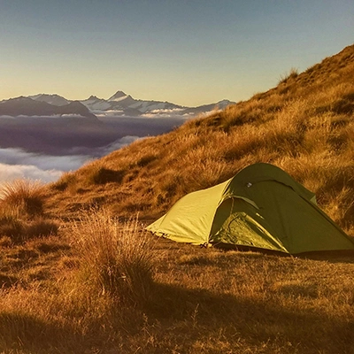 Green Tent On Top Of Mountain.