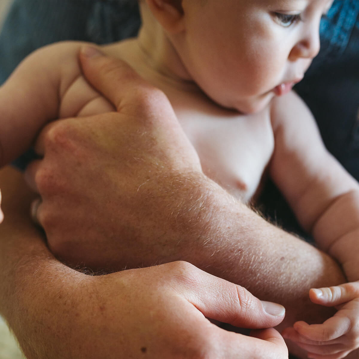 baby in a man's arms