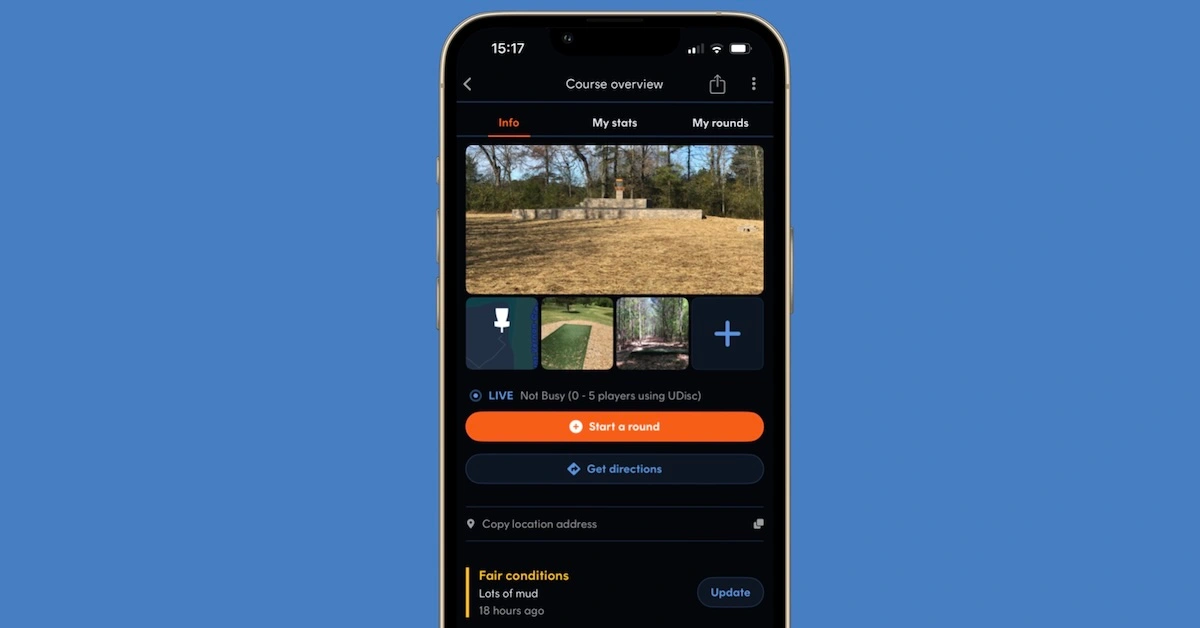 A screen shot in an iPhone frame and blue background of the UDisc disc golf app