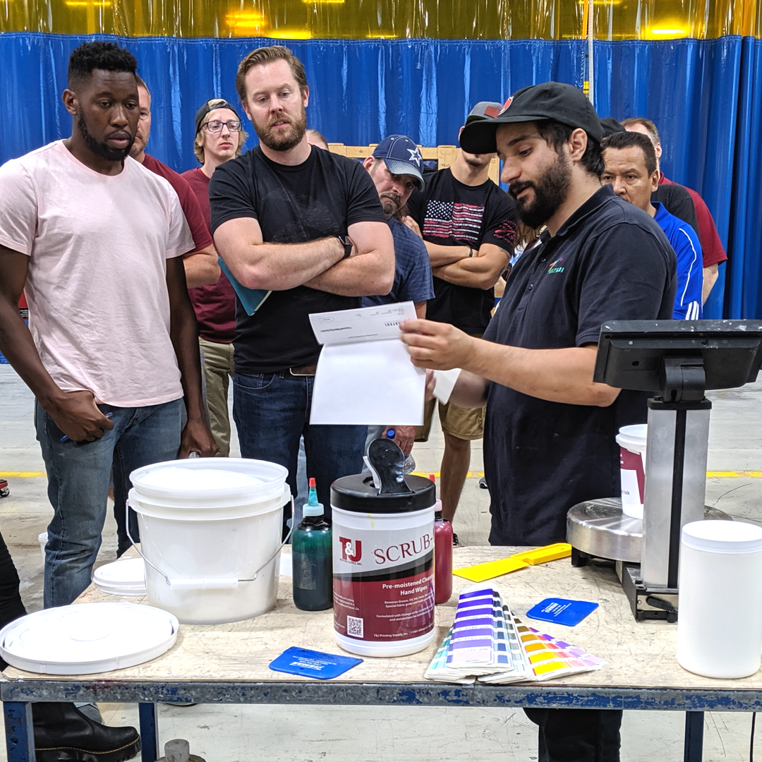 A Matsui technician uses a recipe to calculate a screen printing ink mixture.