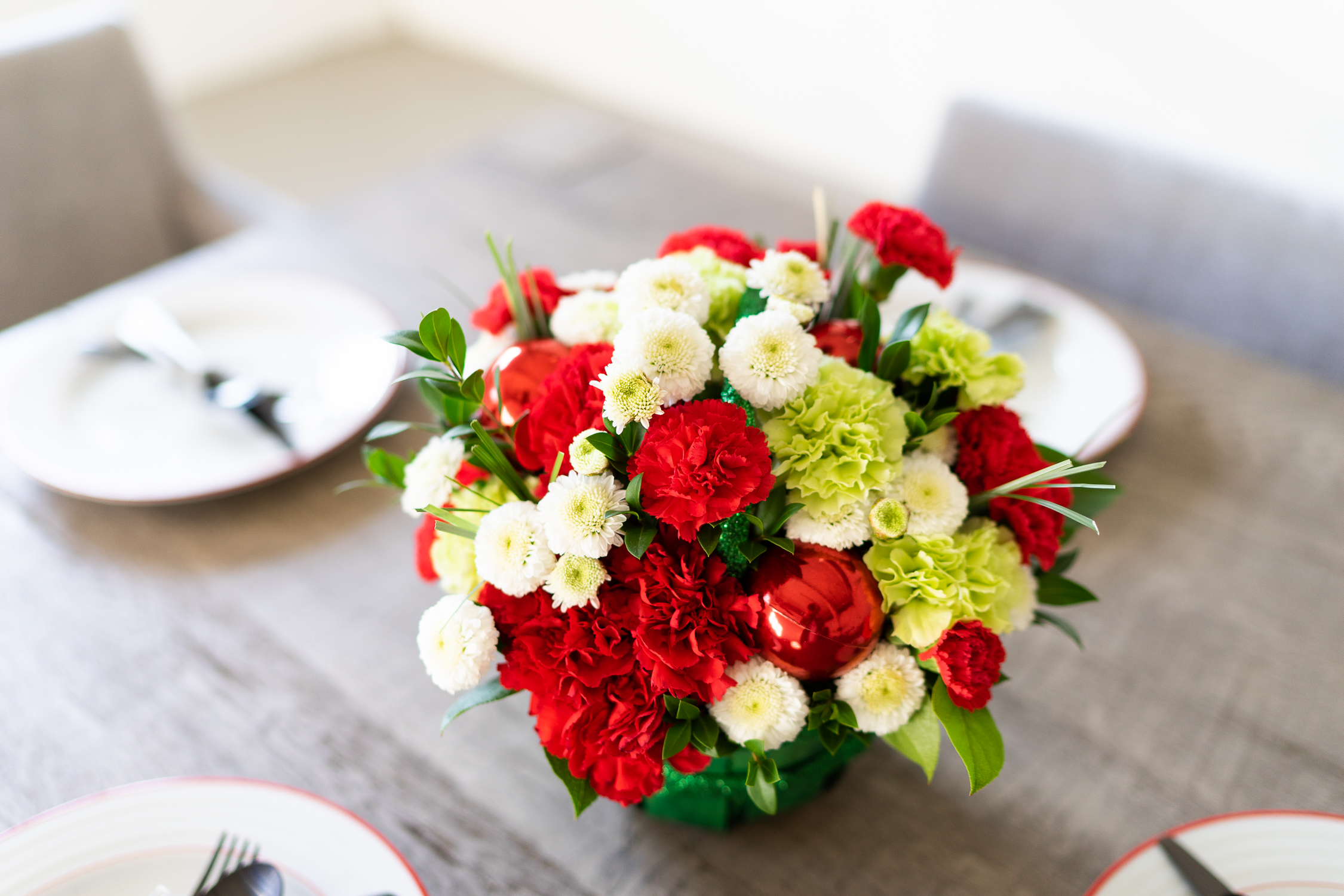 Holiday Centerpiece with Red, White and Green Flowers