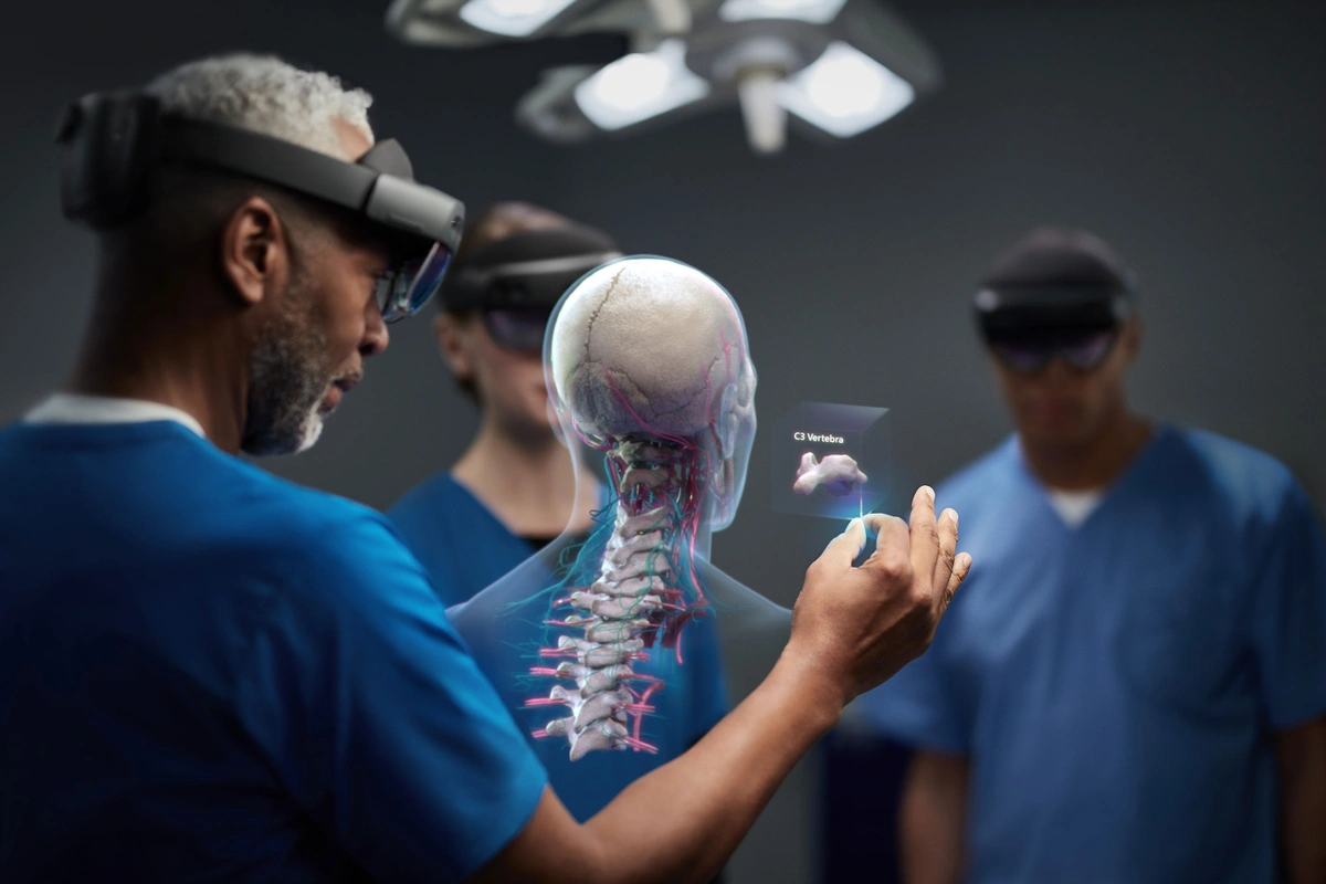 A team uses the HoloLens 2 to analyze a virtual 3D model of a human skeletal and nervous system. Image via Microsoft.