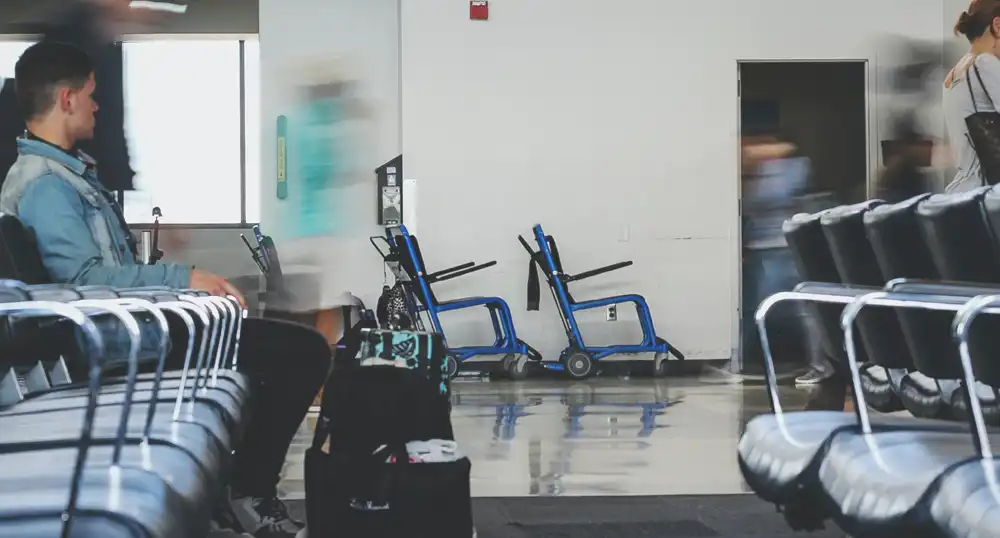 Empty wheelchairs in airport concourse.