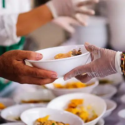 Volunteering at a food kitchen.