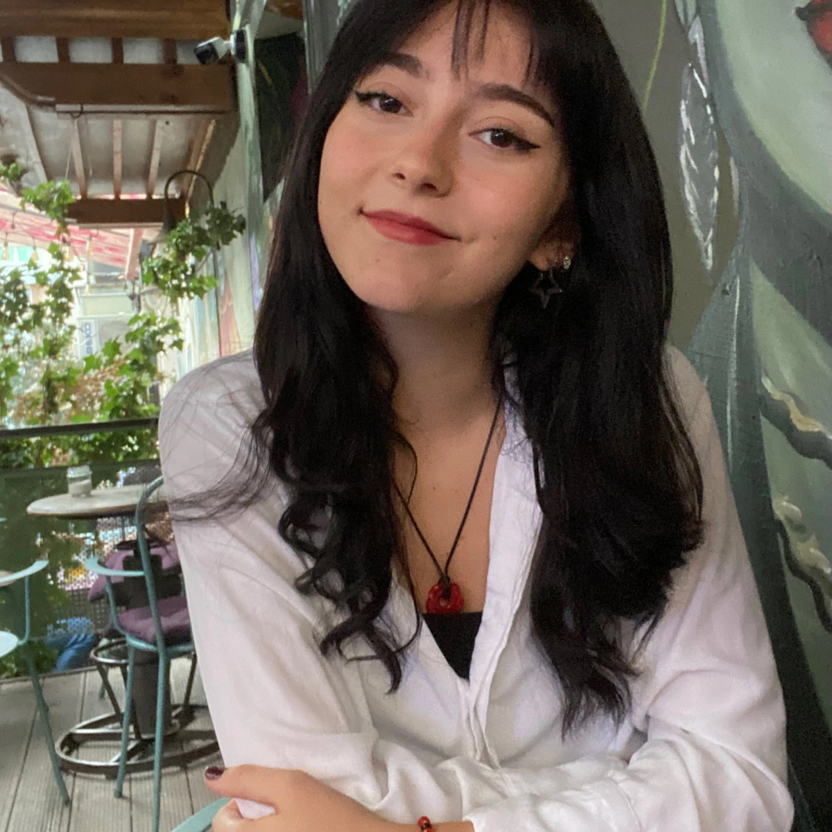 Photograph of Era, Pathways student, sitting down outside in Kosovo