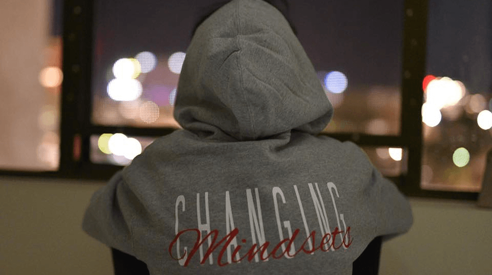 Person wearing Changing Mindsets hoodie sweatshirt