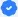 A white tick on a blue background.